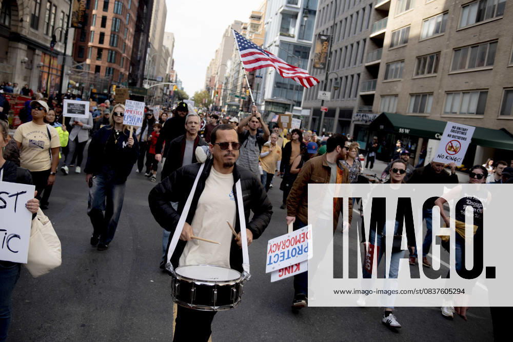 Protesters march down Broadway during the â€oeNo Kings†rally in New York, Saturday, Oct. 18, 2025. The demonstration began in Times Square and ended in Union Square, drawing an estimated 50,000 people who joined others across the country calling for the protection of democratic institutions and denouncing authoritarian leadership. Organizers said more than 5 million people participated in over 2,000 marches nationwide. New York USA - ZUMAa306 20251018_znp_a306_001