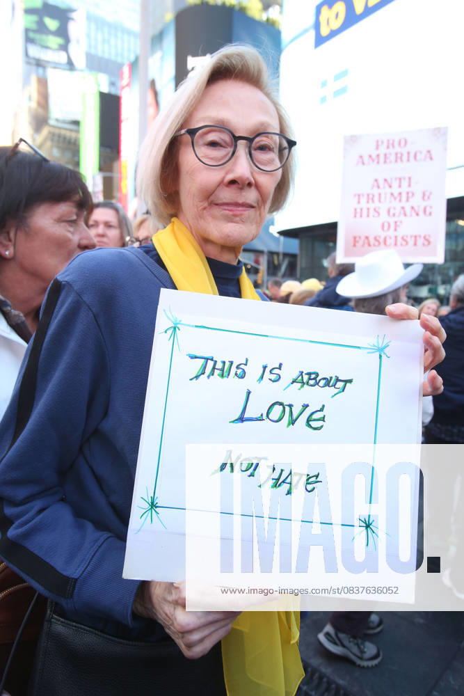A woman holds a sign during the No Kings protest in New York City on Oct. 18, 2025. Tens of thousands of people hit New York City streets to protest Donald Trump, autocracy, ICE and immigrant deportations. More than 2,500 similar protests took place nationwide. New York City USA - ZUMAk45_ 20251018_zaf_k45_011