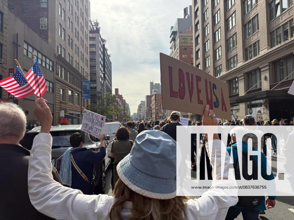 Protesters march in the No Kings Protest against the Trump administration down Seventh Avenue in Chelsea on October 18, 2025 in New York. New York USA - ZUMAb148 20251018_zap_b148_008