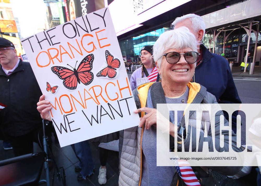 A woman holds a sign during a No KIngs protest in New York City on Oct. 18, 2025. Tens of thousands of people hit New York City streets to protest Donald Trump, autocracy, ICE and immigrant deportations. More than 2,500 similar protests took place nationwide. New York City USA - ZUMAk45_ 20251018_zaf_k45_069