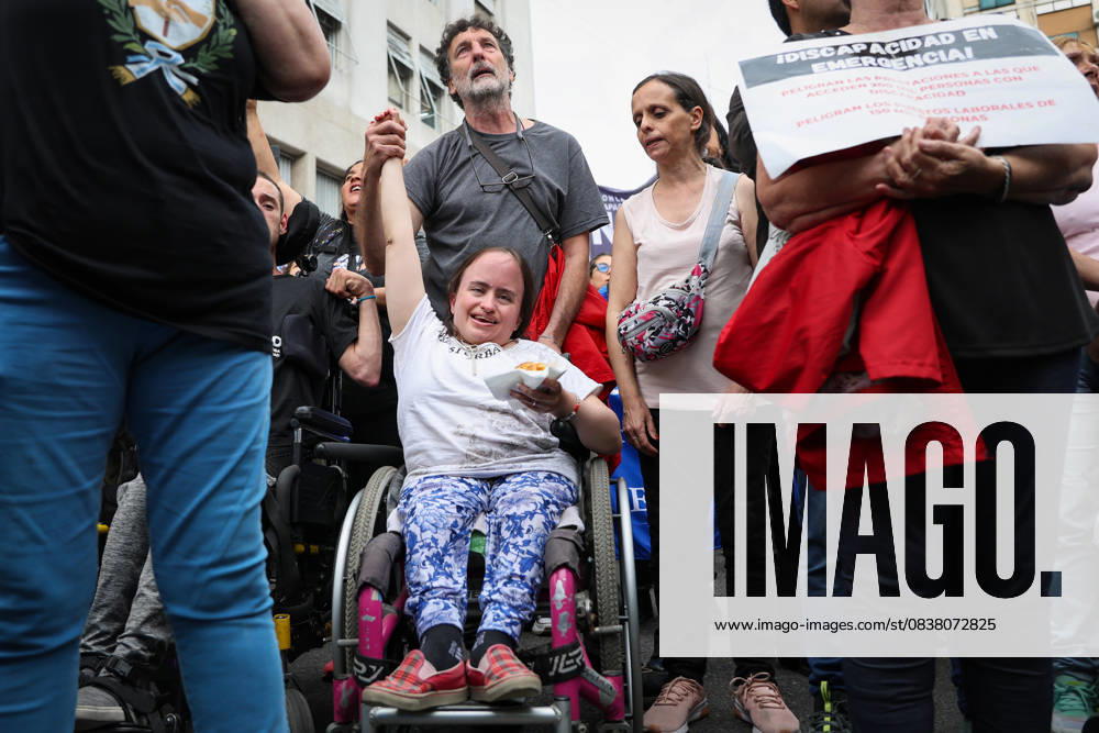 Young person with a disability smiles near the National Ministry of Health during the demonstration calling for enforcement of the Disability Emergency Law. Buenos Aires Argentina - ZUMAp265 20251022_zip_p265_010
