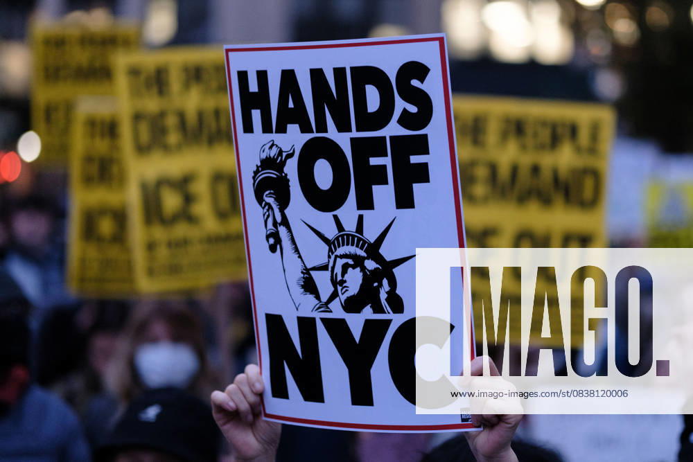 A protester holds a sign saying â€oeHANDS OFF NYC†during an anti-ICE demonstration at Foley Square, in New York, on Wednesday, Oct. 22, 2025. This response comes after more than 50 federal agents arrested immigrant vendors at Canal Street, lower Manhattan, on Tuesday. New York USA - ZUMAs368 20251022_zip_s368_004