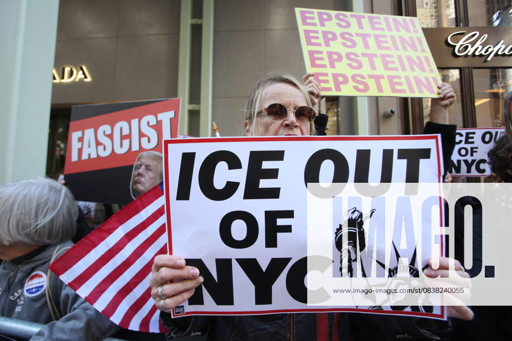 A woman holds a sign that says ICE Out of NYC during a Hands Off NYC rally. outside of Trump Tower on October 25, 2025. Some women wore polka dots in honor of a protestor who confronted ICE agents and tank vehicles. The peaceful rally drew a handful of Trump supporters. New York City USA - ZUMAk45_ 20251025_zaf_k45_010