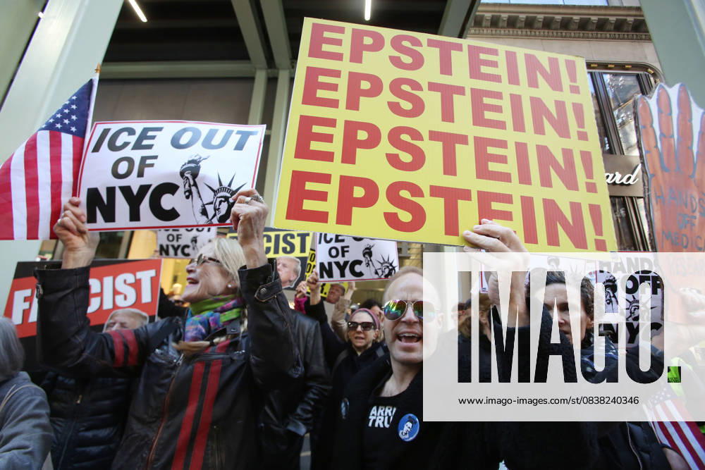 A man holds a sign that says Epstein! Epstein! Epstein!Epstein! during a Hands Off NYC rally. outside of Trump Tower on October 25, 2025. Some women wore polka dots in honor of a protestor who confronted ICE agents and tank vehicles. The peaceful rally drew a handful of Trump supporters. New York City USA - ZUMAk45_ 20251025_zaf_k45_014