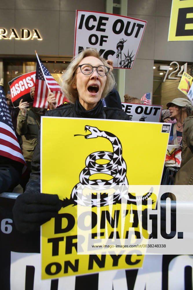 A woman holds a sign that says Don t Tread on NYC during a Hands Off NYC rally outside of Trump Tower. Some women wore polka dots in honor of a protestor who confronted ICE agents and tank vehicles. The peaceful rally drew a handful of Trump supporters. New York City USA - ZUMAk45_ 20251025_zaf_k45_016