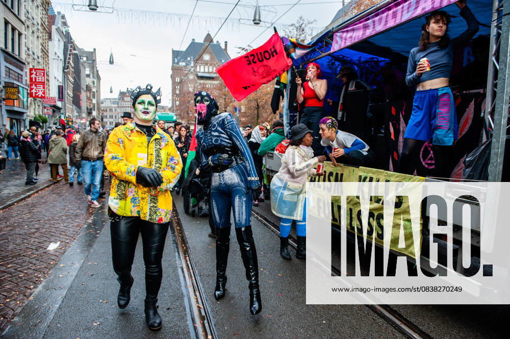 Drag queens are seen accompanying one of the music trucks. ADEV (Amsterdam Danst Ergens Voor), in English Amsterdam Dances For A Cause , organized for the 13th time its annual demonstration for squatting, free spaces, and affordable housing in the city. People danced, accompanied by large trucks and loud music systems, to reclaim more free spaces in the city. Amsterdam Netherlands - ZUMAs197 20251025_aaa_s197_442