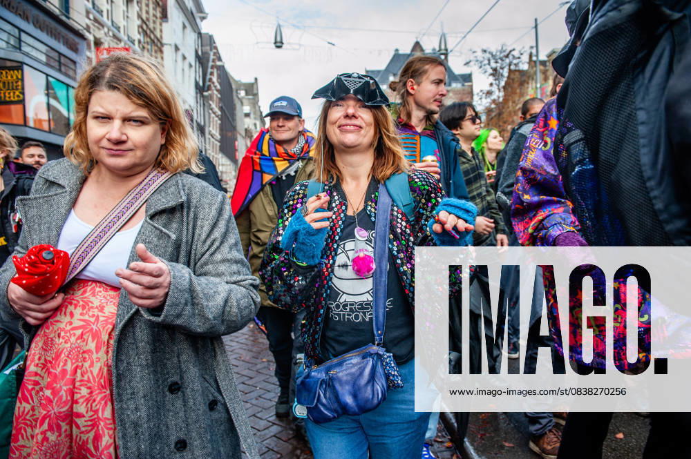 People are seen wearing extravagant clothes while dancing. ADEV (Amsterdam Danst Ergens Voor), in English Amsterdam Dances For A Cause , organized for the 13th time its annual demonstration for squatting, free spaces, and affordable housing in the city. People danced, accompanied by large trucks and loud music systems, to reclaim more free spaces in the city. Amsterdam Netherlands - ZUMAs197 20251025_aaa_s197_444