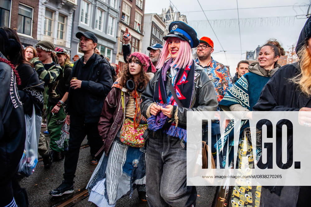 People in extravagant clothes are seen dancing behind the trucks. ADEV (Amsterdam Danst Ergens Voor), in English Amsterdam Dances For A Cause , organized for the 13th time its annual demonstration for squatting, free spaces, and affordable housing in the city. People danced, accompanied by large trucks and loud music systems, to reclaim more free spaces in the city. Amsterdam Netherlands - ZUMAs197 20251025_aaa_s197_447