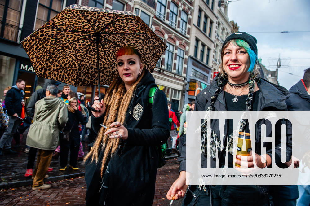 Two women are seen dancing and drinking behind one of the trucks. ADEV (Amsterdam Danst Ergens Voor), in English Amsterdam Dances For A Cause , organized for the 13th time its annual demonstration for squatting, free spaces, and affordable housing in the city. People danced, accompanied by large trucks and loud music systems, to reclaim more free spaces in the city. Amsterdam Netherlands - ZUMAs197 20251025_aaa_s197_454