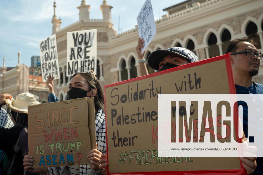 Protesters hold placards during a protest against US President Donald Trump s visit for the Association of Southeast Asian Nations (ASEAN) 47th ASEAN Summit in Kuala Lumpur. Kuala Lumpur Malaysia - ZUMAr146 20251026_zap_r146_003