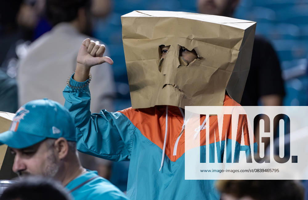 A Miami Dolphins fan wears a paper bag over his head to show frustration after the teamâ€⠢s 28-6 loss to the Baltimore Ravens at Hard Rock Stadium on Oct. 30, 2025, in Miami Gardens, Florida. Miami Gardens United States - ZUMAm67_ 20251030_zaf_m67_027