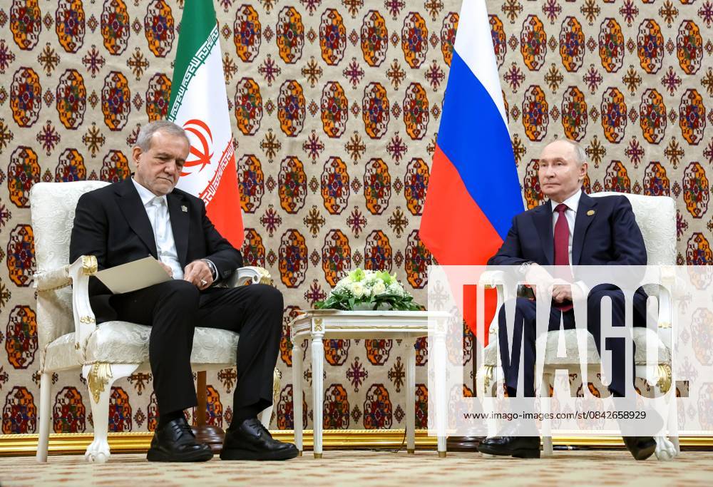 Turkmenistan Russia 9070071 12.12.2025 Iranian President Masoud Pezeshkian and Russian President Vladimir Putin attend a meeting in Ashgabat, Turkmenistan. Alexander Kazakov Sputnik Ashgabat Turkmenistan