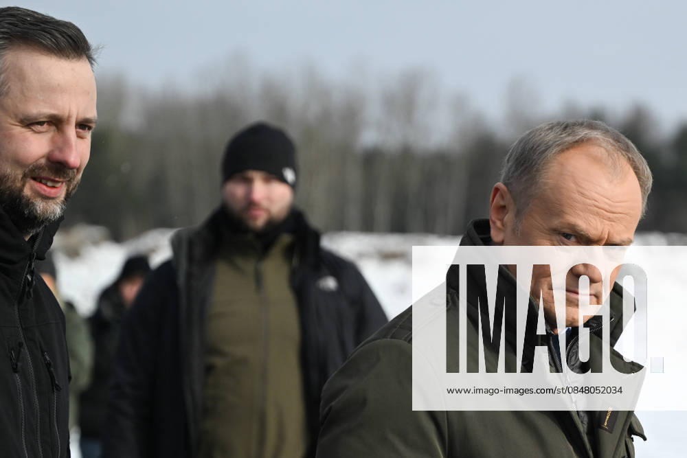 Polish PM Tusk Observes Military Drone Systems Demonstration ZIELONKA, POLAND – FEBRUARY 19: Polish Prime Minister Donald Tusk (R), and Minister of National Defence Wladyslaw Kosiniak-Kamysz (L) arrive at the press briefing after observing open tests of unmanned weapon systems at the Military Institute of Armament Technology training ground in Zielonka, Masovian Voivodeship, Poland, on February 19, 2026. The event brings together companies from the Polish Armaments Group (PGZ) Capital Group and leading military and civilian research institutes to jointly demonstrate aerial and ground unmanned strike, reconnaissance, evacuation and transport systems. Artur Widak Anadolu Zielonka Poland. Editorial use only. Please get in touch for any other