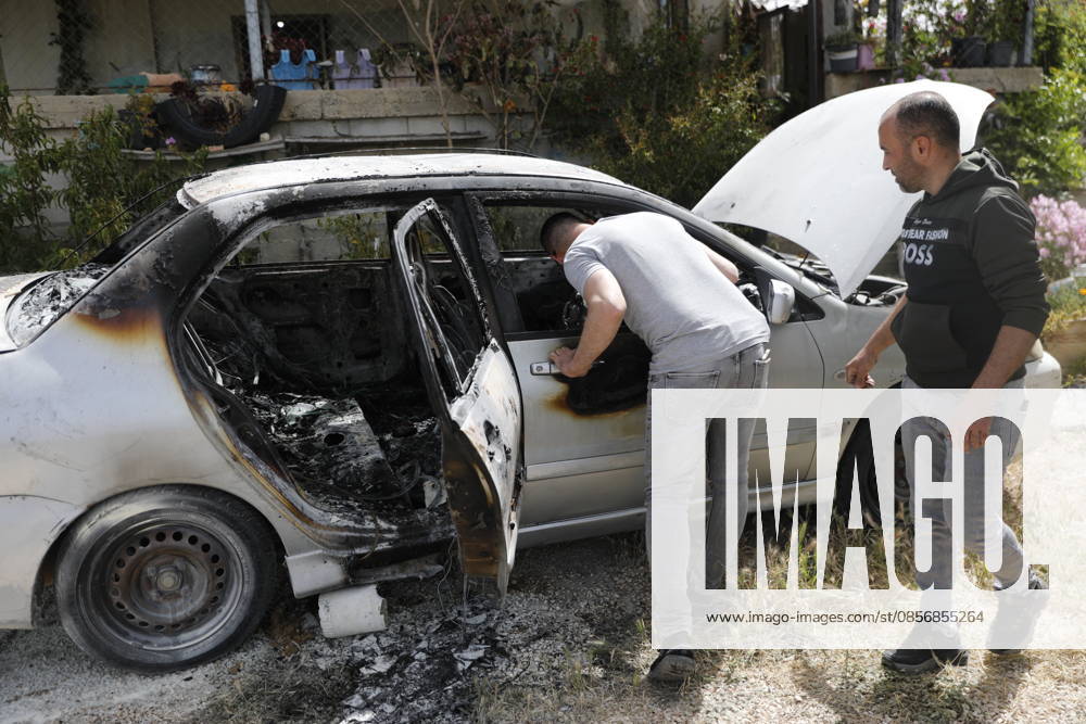 Palestinians inspect damage after settler attack near Hebron Palestinians inspect damage at the site of an attack carried out by Israeli settlers targeting Palestinian vehicles and property in the town of Surif northwest of Hebron in the occupied West Bank on May 17, 2026. Settlers set fire to a vehicle and spray-painted racist slogans at the scene, amid anger and condemnation among Palestinian residents over repeated attacks on their property. Photo by Mamoun Wazwaz apaimages Hebron West Bank Palestinian Territory 170526_Hebron_MW_00(15)
