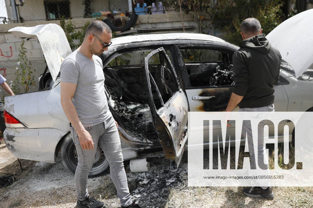 Palestinians inspect damage after settler attack near Hebron Palestinians inspect damage at the site of an attack carried out by Israeli settlers targeting Palestinian vehicles and property in the town of Surif northwest of Hebron in the occupied West Bank on May 17, 2026. Settlers set fire to a vehicle and spray-painted racist slogans at the scene, amid anger and condemnation among Palestinian residents over repeated attacks on their property. Photo by Mamoun Wazwaz apaimages Hebron West Bank Palestinian Territory 170526_Hebron_MW_00(14)