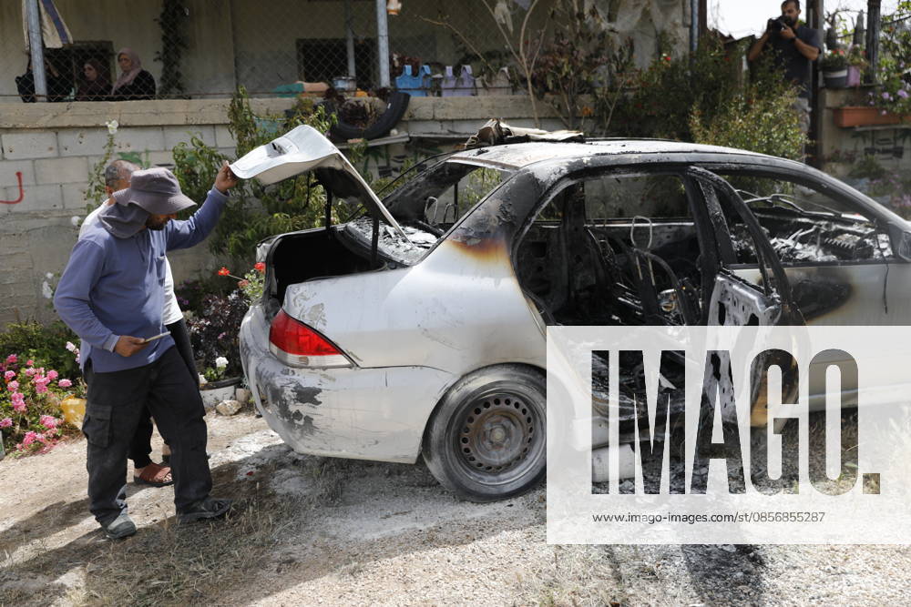Palestinians inspect damage after settler attack near Hebron Palestinians inspect damage at the site of an attack carried out by Israeli settlers targeting Palestinian vehicles and property in the town of Surif northwest of Hebron in the occupied West Bank on May 17, 2026. Settlers set fire to a vehicle and spray-painted racist slogans at the scene, amid anger and condemnation among Palestinian residents over repeated attacks on their property. Photo by Mamoun Wazwaz apaimages Hebron West Bank Palestinian Territory 170526_Hebron_MW_00(34)