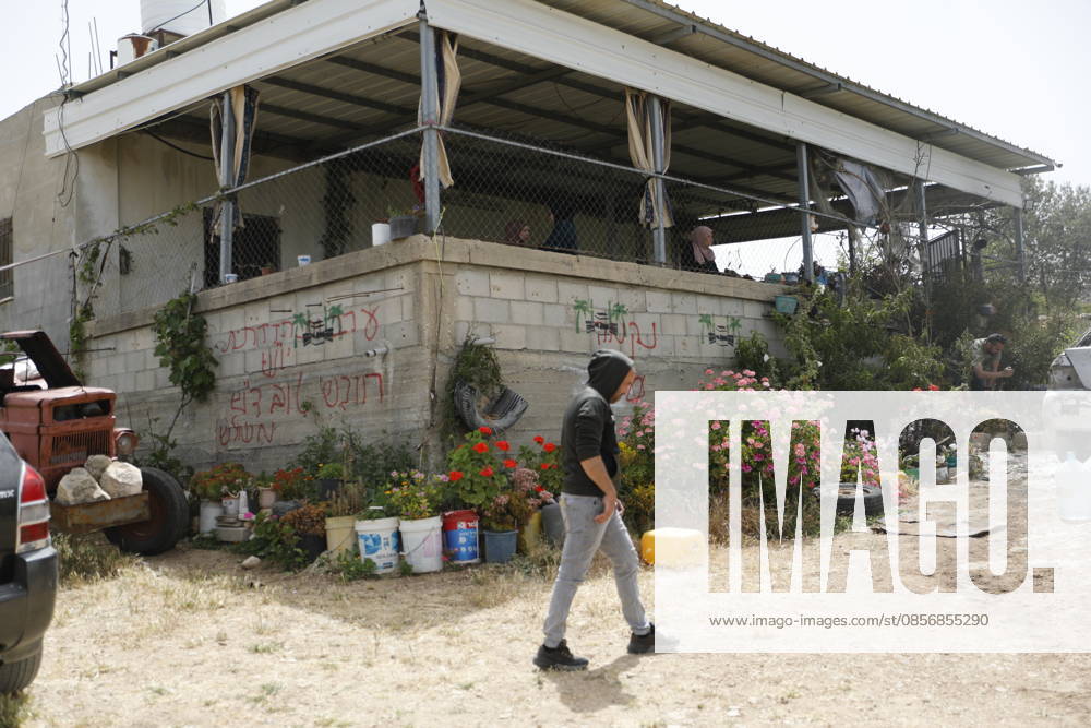 Palestinians inspect damage after settler attack near Hebron Palestinians inspect damage at the site of an attack carried out by Israeli settlers targeting Palestinian vehicles and property in the town of Surif northwest of Hebron in the occupied West Bank on May 17, 2026. Settlers set fire to a vehicle and spray-painted racist slogans at the scene, amid anger and condemnation among Palestinian residents over repeated attacks on their property. Photo by Mamoun Wazwaz apaimages Hebron West Bank Palestinian Territory 170526_Hebron_MW_00(35)