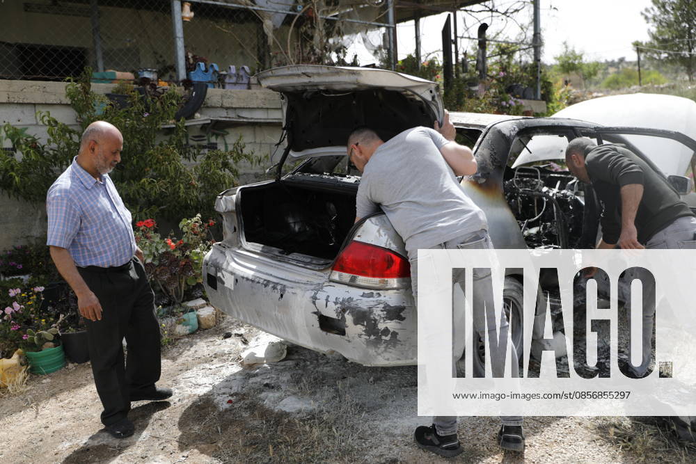 Palestinians inspect damage after settler attack near Hebron Palestinians inspect damage at the site of an attack carried out by Israeli settlers targeting Palestinian vehicles and property in the town of Surif northwest of Hebron in the occupied West Bank on May 17, 2026. Settlers set fire to a vehicle and spray-painted racist slogans at the scene, amid anger and condemnation among Palestinian residents over repeated attacks on their property. Photo by Mamoun Wazwaz apaimages Hebron West Bank Palestinian Territory 170526_Hebron_MW_00(11)