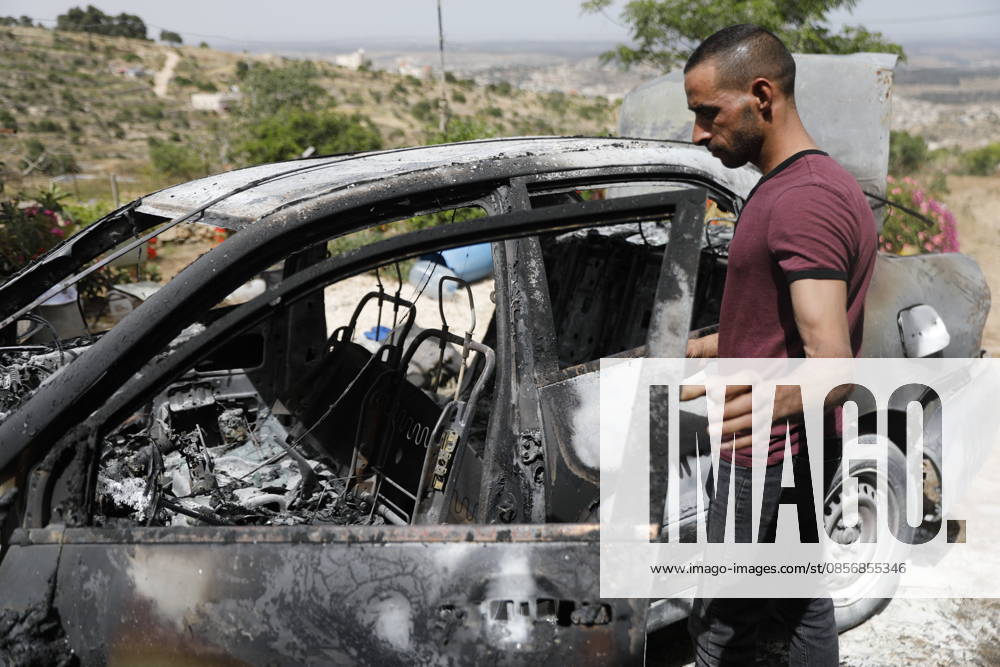 Palestinians inspect damage after settler attack near Hebron Palestinians inspect damage at the site of an attack carried out by Israeli settlers targeting Palestinian vehicles and property in the town of Surif northwest of Hebron in the occupied West Bank on May 17, 2026. Settlers set fire to a vehicle and spray-painted racist slogans at the scene, amid anger and condemnation among Palestinian residents over repeated attacks on their property. Photo by Mamoun Wazwaz apaimages Hebron West Bank Palestinian Territory 170526_Hebron_MW_00(1)