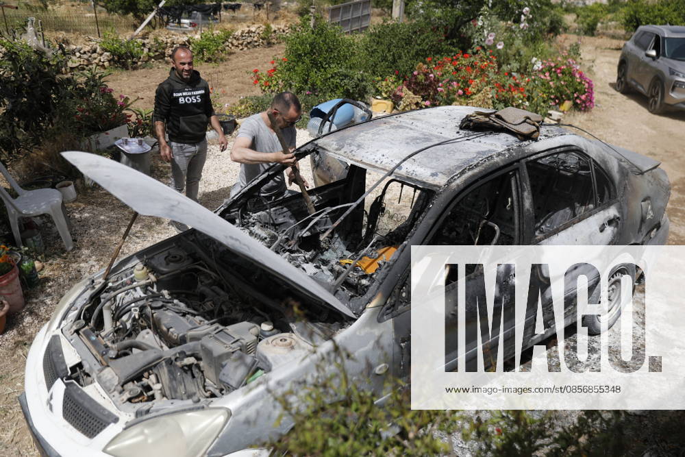 Palestinians inspect damage after settler attack near Hebron Palestinians inspect damage at the site of an attack carried out by Israeli settlers targeting Palestinian vehicles and property in the town of Surif northwest of Hebron in the occupied West Bank on May 17, 2026. Settlers set fire to a vehicle and spray-painted racist slogans at the scene, amid anger and condemnation among Palestinian residents over repeated attacks on their property. Photo by Mamoun Wazwaz apaimages Hebron West Bank Palestinian Territory 170526_Hebron_MW_00(23)