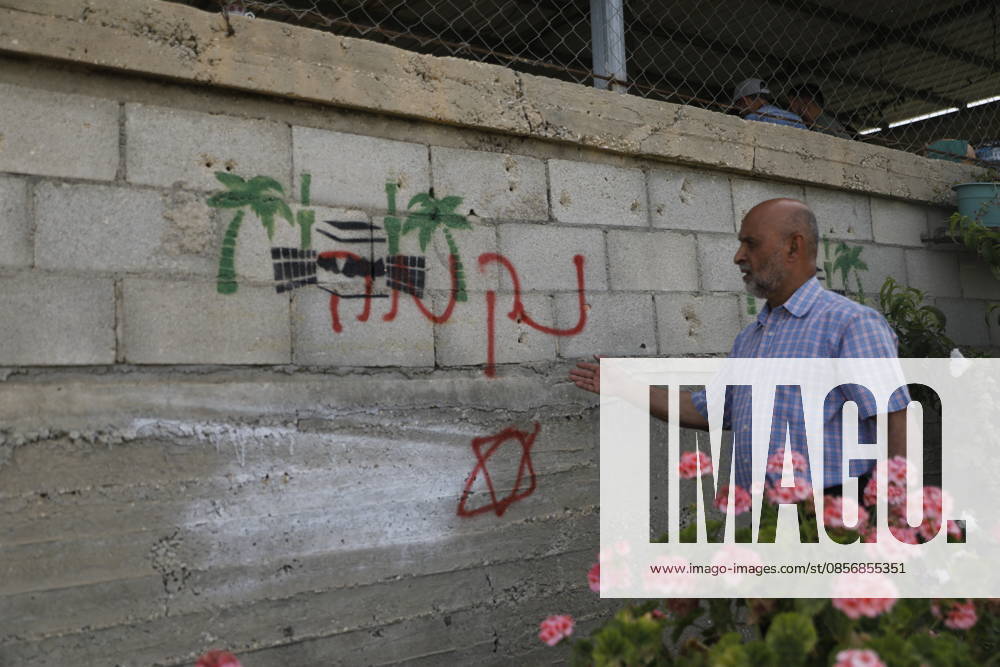 Palestinians inspect damage after settler attack near Hebron Palestinians inspect damage at the site of an attack carried out by Israeli settlers targeting Palestinian vehicles and property in the town of Surif northwest of Hebron in the occupied West Bank on May 17, 2026. Settlers set fire to a vehicle and spray-painted racist slogans at the scene, amid anger and condemnation among Palestinian residents over repeated attacks on their property. Photo by Mamoun Wazwaz apaimages Hebron West Bank Palestinian Territory 170526_Hebron_MW_00(24)