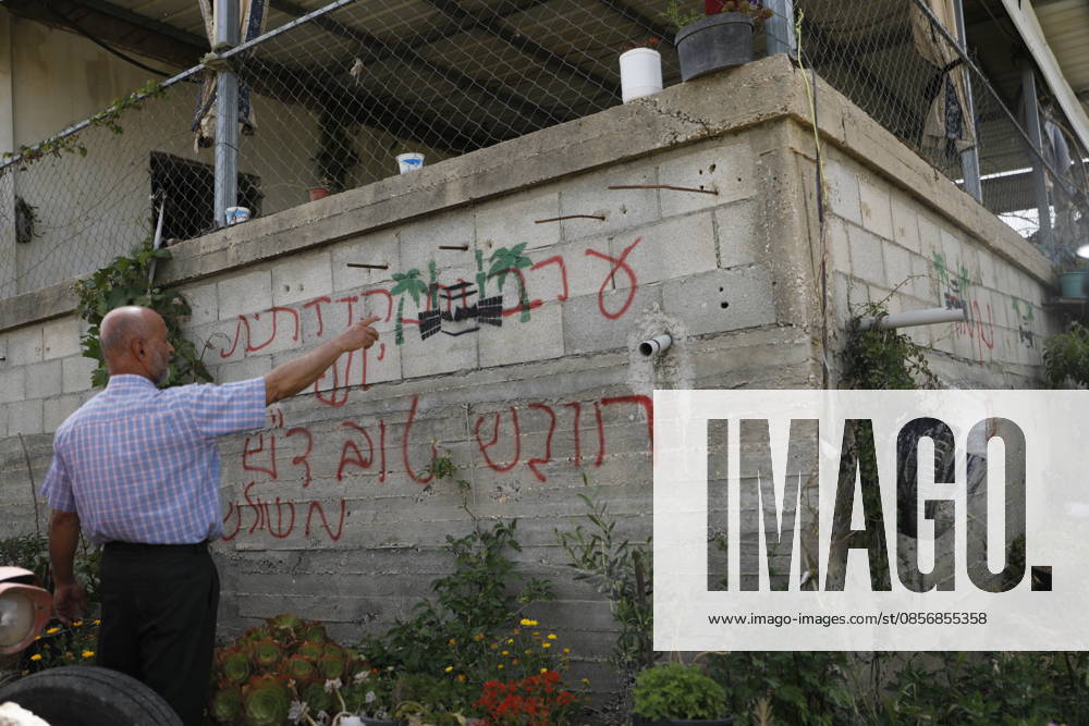 Palestinians inspect damage after settler attack near Hebron Palestinians inspect damage at the site of an attack carried out by Israeli settlers targeting Palestinian vehicles and property in the town of Surif northwest of Hebron in the occupied West Bank on May 17, 2026. Settlers set fire to a vehicle and spray-painted racist slogans at the scene, amid anger and condemnation among Palestinian residents over repeated attacks on their property. Photo by Mamoun Wazwaz apaimages Hebron West Bank Palestinian Territory 170526_Hebron_MW_00(27)