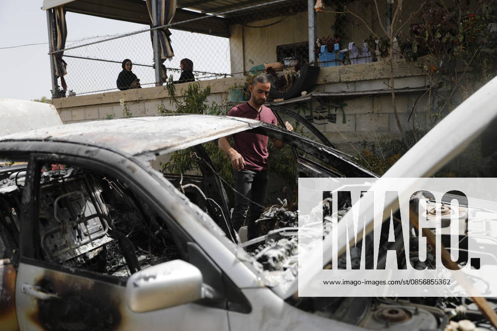 Palestinians inspect damage after settler attack near Hebron Palestinians inspect damage at the site of an attack carried out by Israeli settlers targeting Palestinian vehicles and property in the town of Surif northwest of Hebron in the occupied West Bank on May 17, 2026. Settlers set fire to a vehicle and spray-painted racist slogans at the scene, amid anger and condemnation among Palestinian residents over repeated attacks on their property. Photo by Mamoun Wazwaz apaimages Hebron West Bank Palestinian Territory 170526_Hebron_MW_00(4)