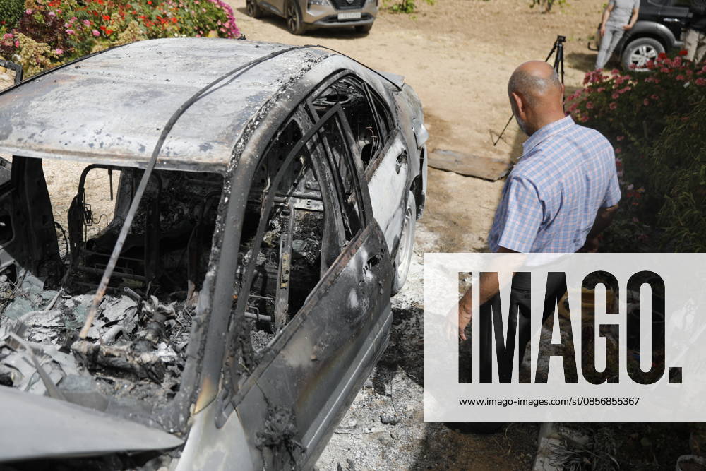 Palestinians inspect damage after settler attack near Hebron Palestinians inspect damage at the site of an attack carried out by Israeli settlers targeting Palestinian vehicles and property in the town of Surif northwest of Hebron in the occupied West Bank on May 17, 2026. Settlers set fire to a vehicle and spray-painted racist slogans at the scene, amid anger and condemnation among Palestinian residents over repeated attacks on their property. Photo by Mamoun Wazwaz apaimages Hebron West Bank Palestinian Territory 170526_Hebron_MW_00(6)