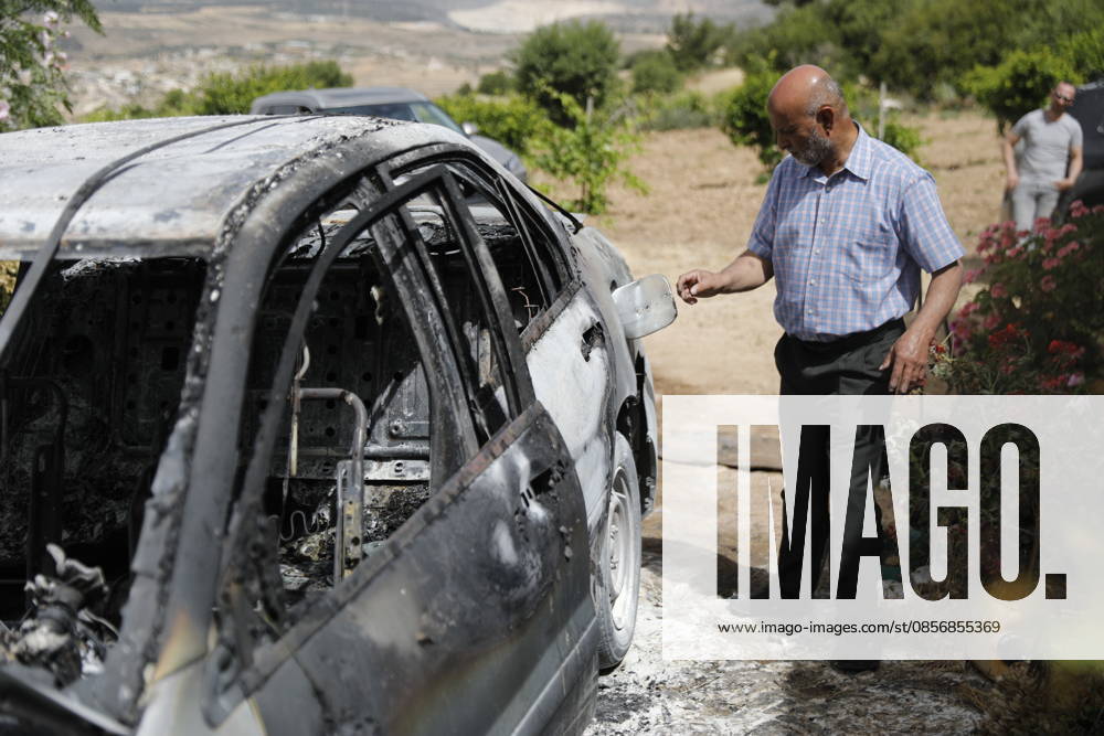 Palestinians inspect damage after settler attack near Hebron Palestinians inspect damage at the site of an attack carried out by Israeli settlers targeting Palestinian vehicles and property in the town of Surif northwest of Hebron in the occupied West Bank on May 17, 2026. Settlers set fire to a vehicle and spray-painted racist slogans at the scene, amid anger and condemnation among Palestinian residents over repeated attacks on their property. Photo by Mamoun Wazwaz apaimages Hebron West Bank Palestinian Territory 170526_Hebron_MW_00(7)