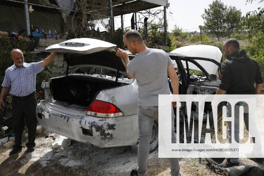 Palestinians inspect damage after settler attack near Hebron Palestinians inspect damage at the site of an attack carried out by Israeli settlers targeting Palestinian vehicles and property in the town of Surif northwest of Hebron in the occupied West Bank on May 17, 2026. Settlers set fire to a vehicle and spray-painted racist slogans at the scene, amid anger and condemnation among Palestinian residents over repeated attacks on their property. Photo by Mamoun Wazwaz apaimages Hebron West Bank Palestinian Territory 170526_Hebron_MW_00(9)