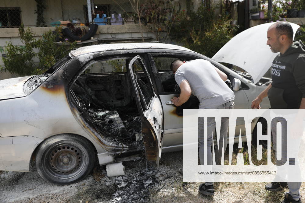 Palestinians inspect damage after settler attack near Hebron Palestinians inspect damage at the site of an attack carried out by Israeli settlers targeting Palestinian vehicles and property in the town of Surif northwest of Hebron in the occupied West Bank on May 17, 2026. Settlers set fire to a vehicle and spray-painted racist slogans at the scene, amid anger and condemnation among Palestinian residents over repeated attacks on their property. Photo by Mamoun Wazwaz apaimages Hebron West Bank Palestinian Territory 170526_Hebron_MW_00(16)