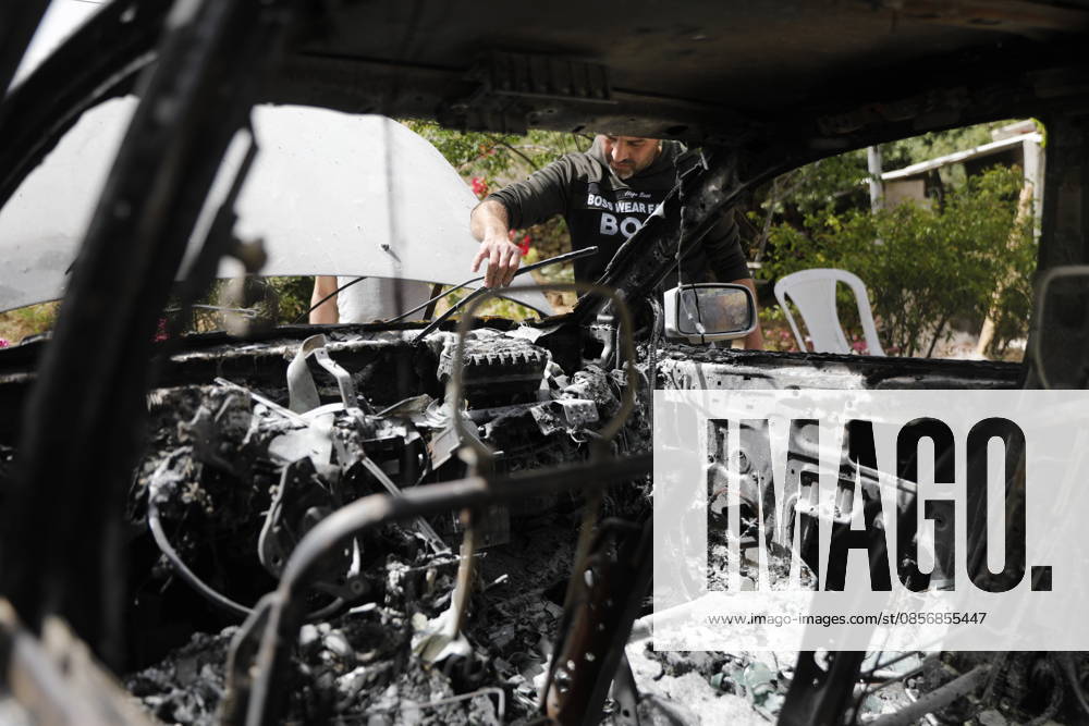 Palestinians inspect damage after settler attack near Hebron Palestinians inspect damage at the site of an attack carried out by Israeli settlers targeting Palestinian vehicles and property in the town of Surif northwest of Hebron in the occupied West Bank on May 17, 2026. Settlers set fire to a vehicle and spray-painted racist slogans at the scene, amid anger and condemnation among Palestinian residents over repeated attacks on their property. Photo by Mamoun Wazwaz apaimages Hebron West Bank Palestinian Territory 170526_Hebron_MW_00(18)