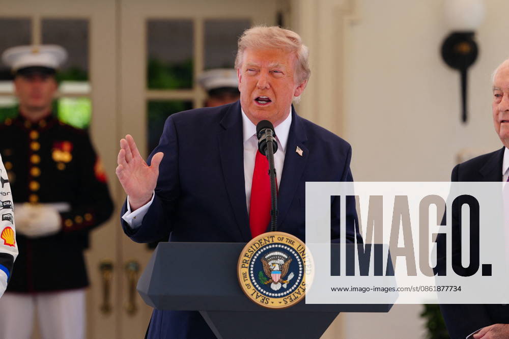 United States President Donald J Trump makes remarks as he hosts top IndyCar drivers at the White House in Washington, DC, USA, to promote the inaugural Freedom 250 Grand Prix on Monday, July 13, 2026. The race will be held in DC on August 22-23, 2026. Looking on from right is IndyCar series owner Roger Penske. Credit: CNP AdMedia Washington District of Columbia United States of America