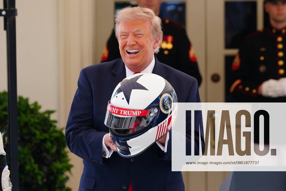 United States President Donald J Trump holds a racing helmet as he hosts top IndyCar drivers at the White House in Washington, DC, USA, to promote the inaugural Freedom 250 Grand Prix on Monday, July 13, 2026. The race will be held in DC on August 22-23, 2026. Credit: CNP AdMedia Washington District of Columbia United States of America