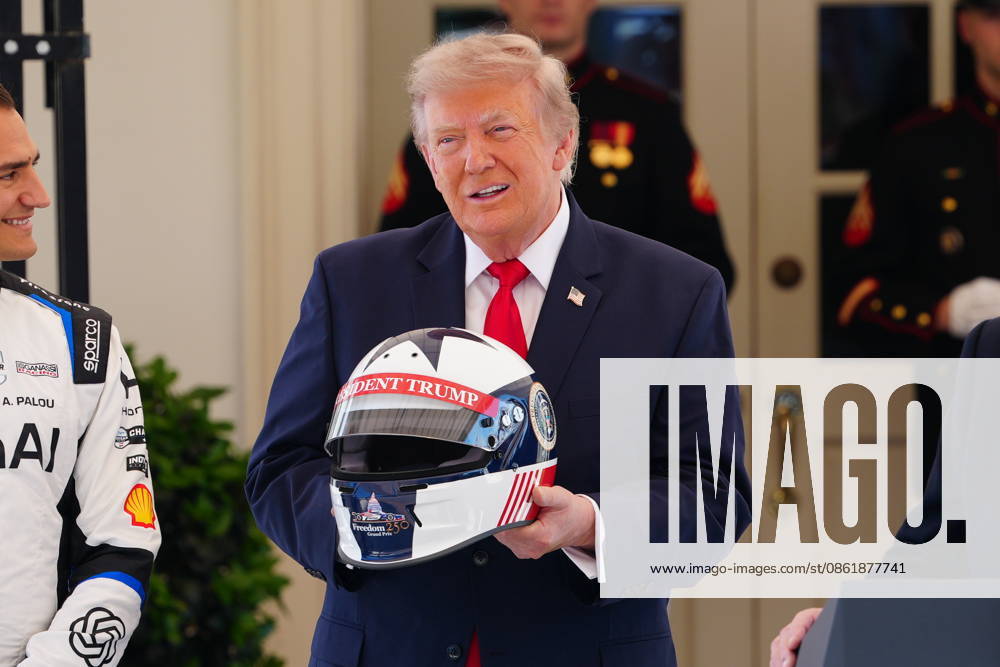 United States President Donald J Trump holds a racing helmet as he hosts top IndyCar drivers at the White House in Washington, DC, USA, to promote the inaugural Freedom 250 Grand Prix on Monday, July 13, 2026. The race will be held in DC on August 22-23, 2026. Credit: CNP AdMedia Washington District of Columbia United States of America