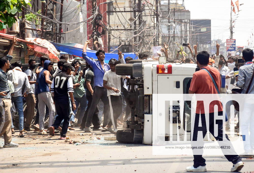 Clashes erupt between police and protesters during the Bihar Bandh protest Patna, Jul 25 (ANI): Protesters damage a police vehicle during the Bihar Bandh protest against the alleged NEET paper leak, in Patna on Saturday. PATNA BIHAR INDIA