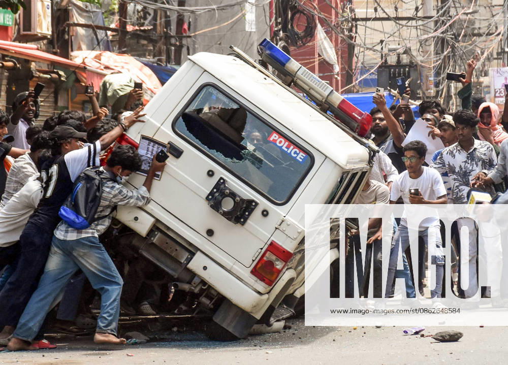 Clashes erupt between police and protesters erupt during the Bihar Bandh protest Patna, Jul 25 (ANI): Protesters damage a police vehicle during the Bihar Bandh protest against the alleged NEET paper leak, in Patna on Saturday. PATNA BIHAR INDIA