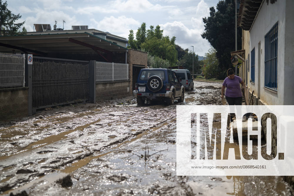 Heavy rains in Catalonia leave two dead and the Besòs River at risk of flooding. Residents clean up the mud that has accumulated in the streets and homes due to the torrential rains, on October 4, 2026, in Montornès del Vallès, Barcelona, Catalonia, Spain. The storm hitting Catalonia has left two people dead in the region. The president of the Generalitat, Salvador Illa, reported the death in Tordera of a 75-year-old man, who was at a campground when a wall reportedly collapsed on him. The second victim is a person who had been reported missing and was found in Montornès del Vallès. Emergency services are searching for another missing person in Riera de Pineda de Mar. The rains and storms have put eleven autonomous communities on alert thi