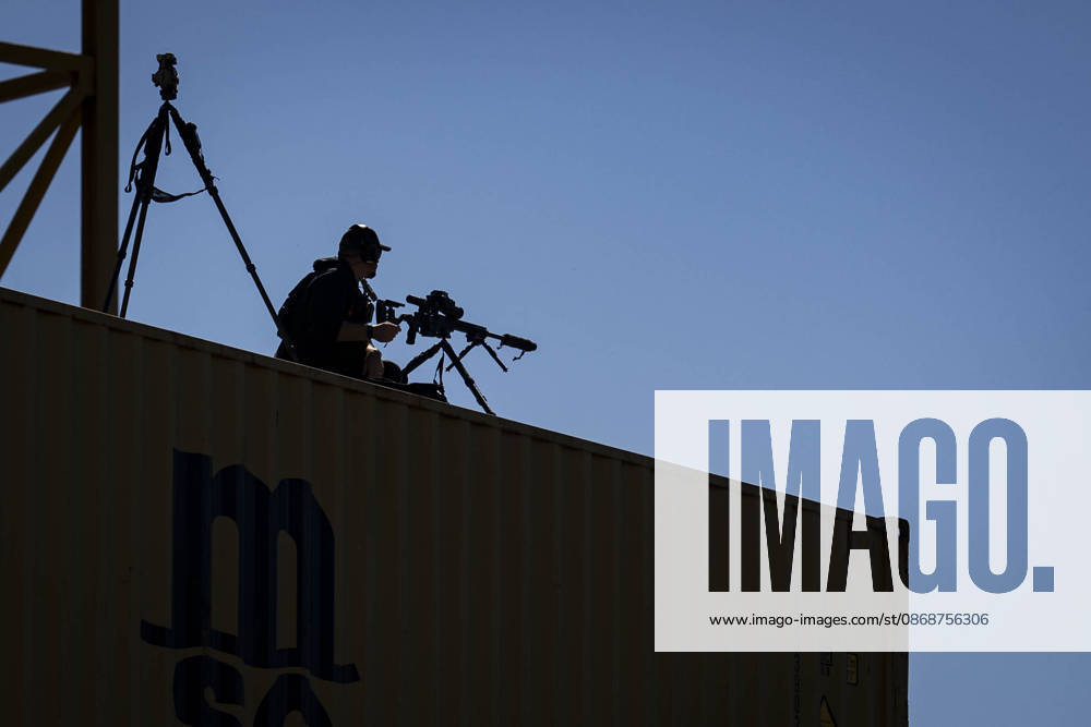 A member of US Secret Service Counter Sniper (CS) keeps watch during an event at Tradepoint Atlantic in Sparrows Point, Maryland on Tuesday, Oct. 6, 2026. Anduril is in advanced talks to build an autonomous surface-vessel factory at Tradepoint Atlantic, which would give the company an East Coast hub alongside its Foss Maritime shipyard in Seattle and undersea-vehicle factory at Quonset Business Park in Rhode Island. BAL20261006101 AlxDrago