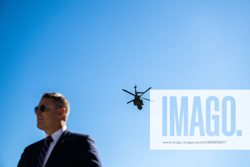 Trump Makes Oval Office Announcement WASHINGTON, DC - OCT. 7: A Secret Service agent stands guard as US President Donald Trump departs the White House in Marine One on Wednesday, Oct. 7, 2026 in Washington, D.C. (Photo by Annabelle Gordon Pool For The Washington Post) Washington DC United States