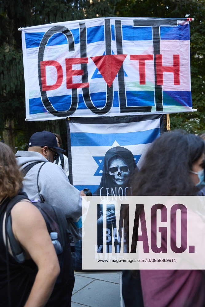 A protester holds a sign bearing the word DEATH during a pro-Palestinian rally at City Hall Park in New York City, New York. New York USA - ZUMAs237 20261007_aap_s237_019