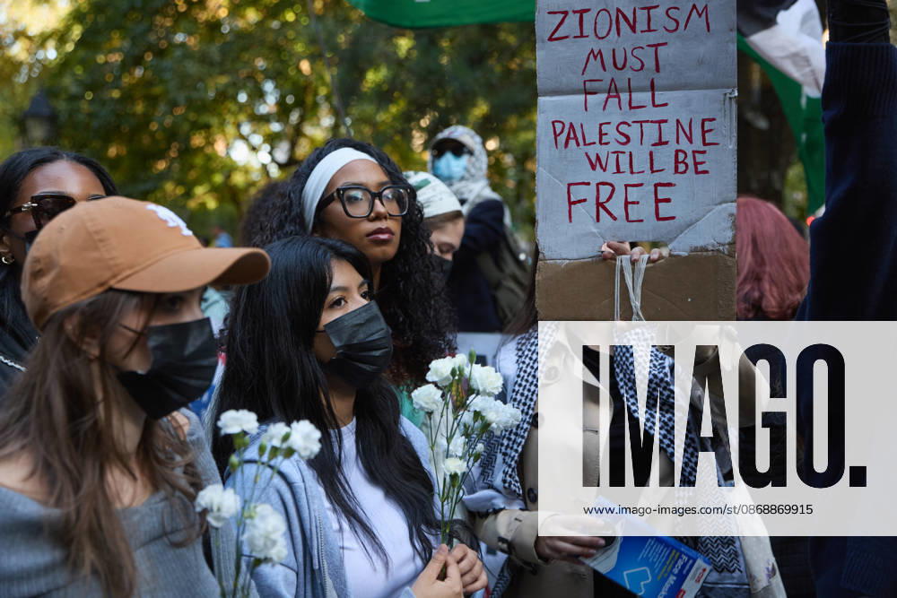 A demonstrator holds a sign reading ZIONISM MUST FALL PALESTINE WILL BE FREE during a pro-Palestinian protest at City Hall Park in New York City. New York USA - ZUMAs237 20261007_aap_s237_021
