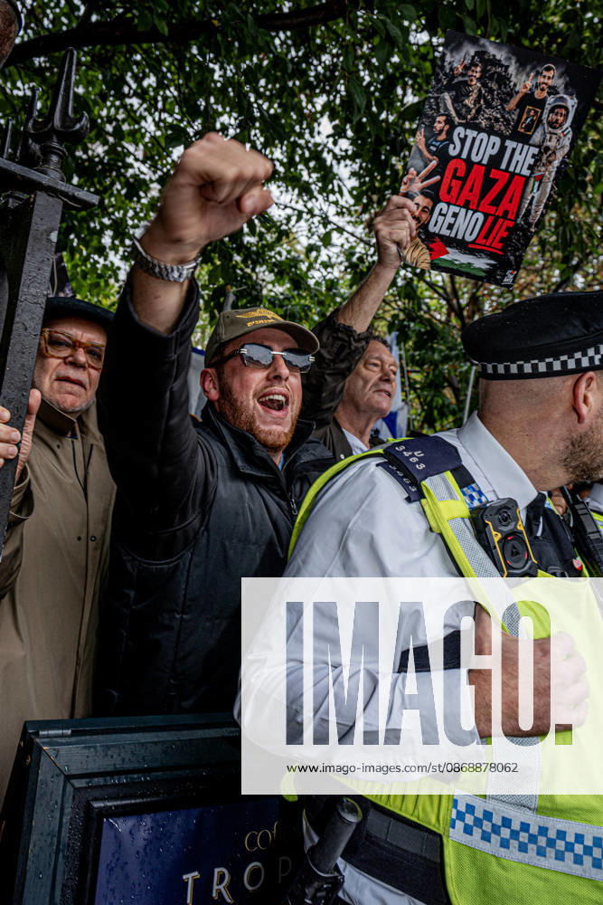 Pro-Israeil counter protestors challenge pro-Palestine demonstrators in London, UK - 7 OCT 2026. Protestors seen chanting slogans while holding placards behind the police cordon separating pro-Israeli counter-protestors from pro-Palestine demonstrators on the 3rd anniversary of Hamas attack. Pro-Palestine activists from Central London Universities chose the 3rd anniversary of the October 7th attack by Hamas to protest against Israel’s war on Gaza. They clashed en route with pro-Israeli counter protestors. The demonstration was arranged by an inter-uni coalition that includes King’s College and LSE. London United Kingdom