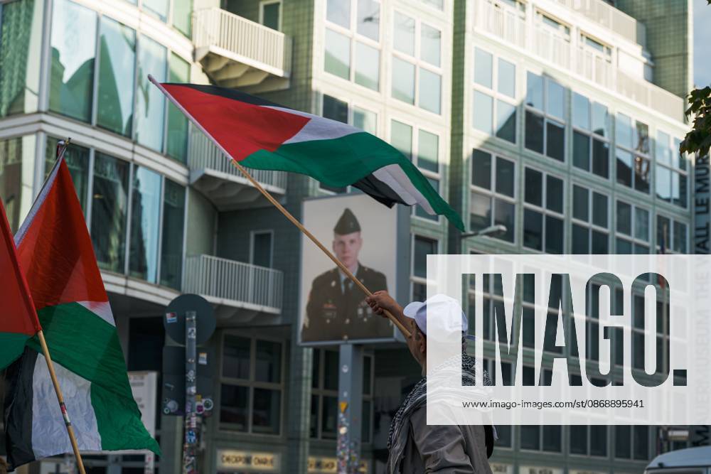 BERLIN, GERMANY, OCTOBER 7, 2026: Demonstrators gather at Checkpoint Charlie in central Berlin to mark three years since the start of the Gaza war. Participants protest against Israelâ€⠢s military actions in Gaza, which they describe as genocide, and express solidarity with Palestinians. Berlin Germany - ZUMAq101 20261007_zna_q101_406