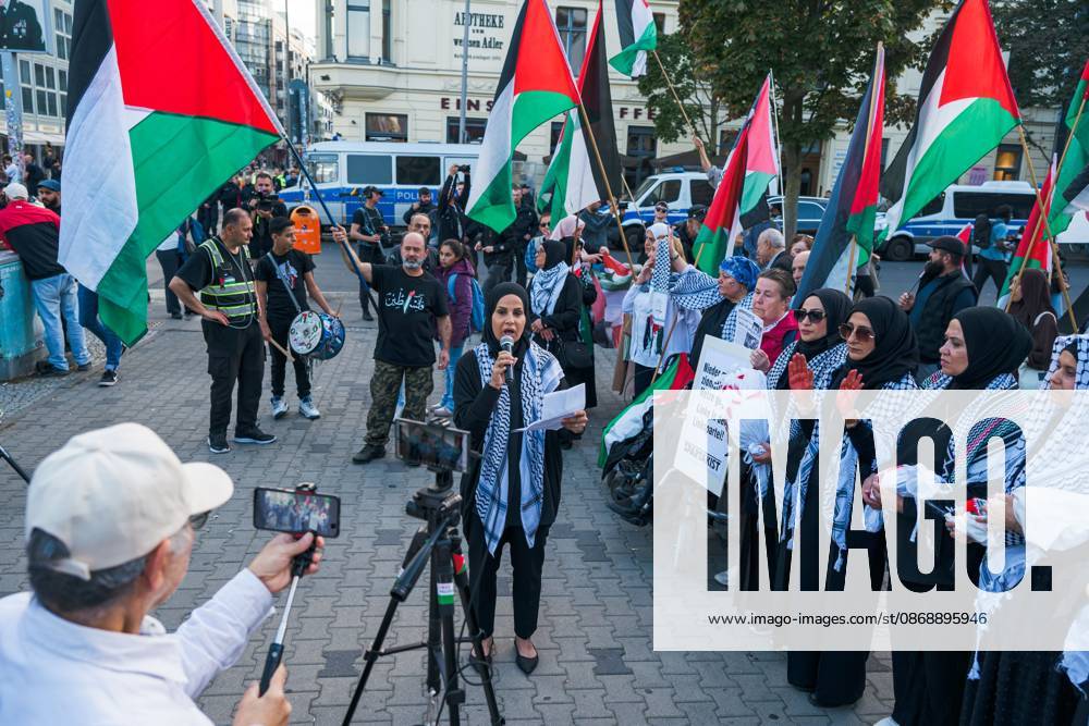 BERLIN, GERMANY, OCTOBER 7, 2026: Demonstrators gather at Checkpoint Charlie in central Berlin to mark three years since the start of the Gaza war. Participants protest against Israelâ€⠢s military actions in Gaza, which they describe as genocide, and express solidarity with Palestinians. Berlin Germany - ZUMAq101 20261007_zna_q101_408