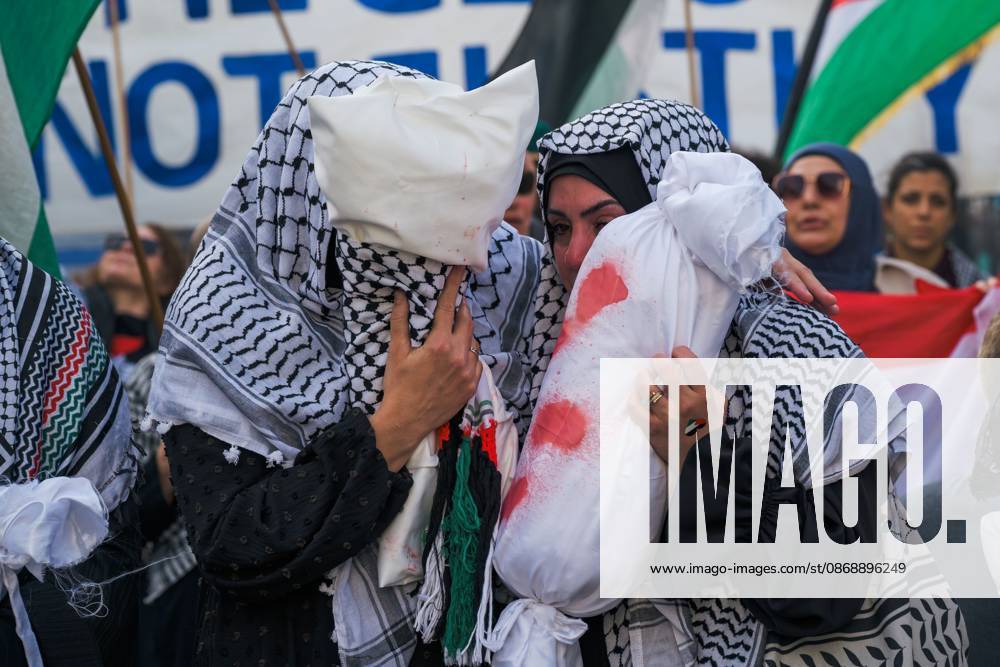 BERLIN, GERMANY, OCTOBER 7, 2026: Demonstrators gather at Checkpoint Charlie in central Berlin to mark three years since the start of the Gaza war. Participants protest against Israelâ€⠢s military actions in Gaza, which they describe as genocide, and express solidarity with Palestinians. Berlin Germany - ZUMAq101 20261007_zna_q101_410