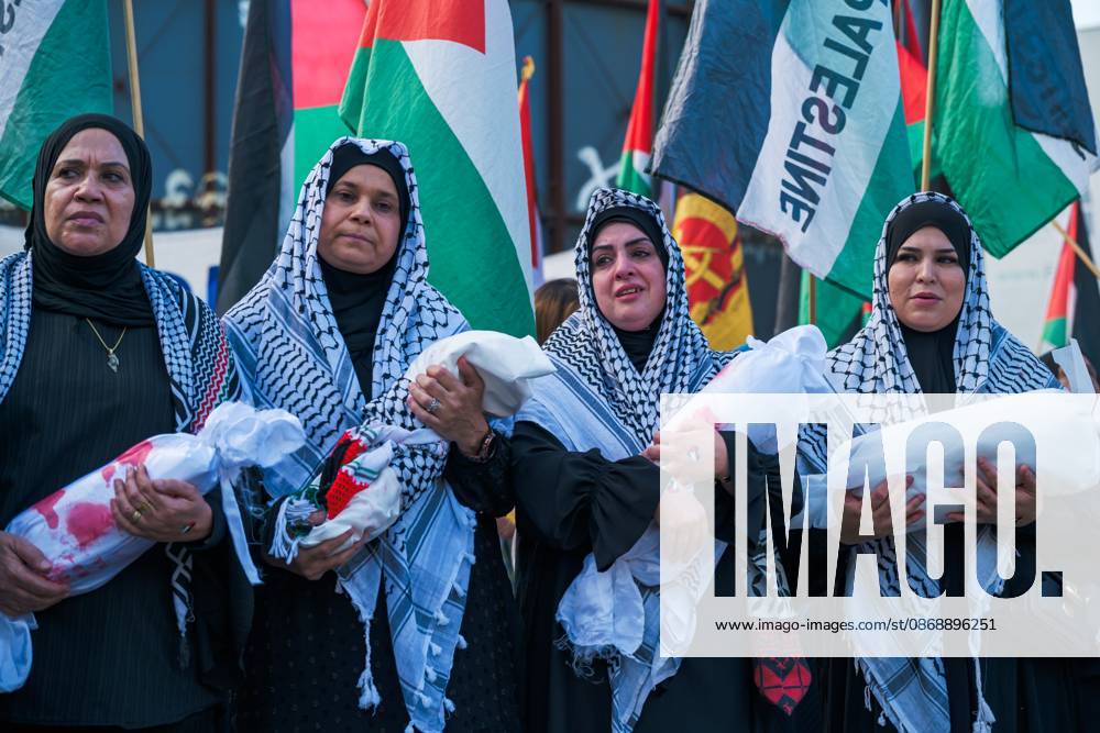 BERLIN, GERMANY, OCTOBER 7, 2026: Demonstrators gather at Checkpoint Charlie in central Berlin to mark three years since the start of the Gaza war. Participants protest against Israelâ€⠢s military actions in Gaza, which they describe as genocide, and express solidarity with Palestinians. Berlin Germany - ZUMAq101 20261007_zna_q101_411
