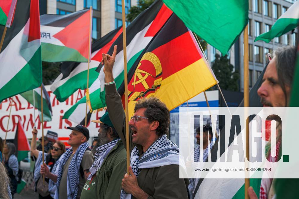 BERLIN, GERMANY, OCTOBER 7, 2026: Demonstrators gather at Checkpoint Charlie in central Berlin to mark three years since the start of the Gaza war. Participants protest against Israelâ€⠢s military actions in Gaza, which they describe as genocide, and express solidarity with Palestinians. Berlin Germany - ZUMAq101 20261007_zna_q101_415