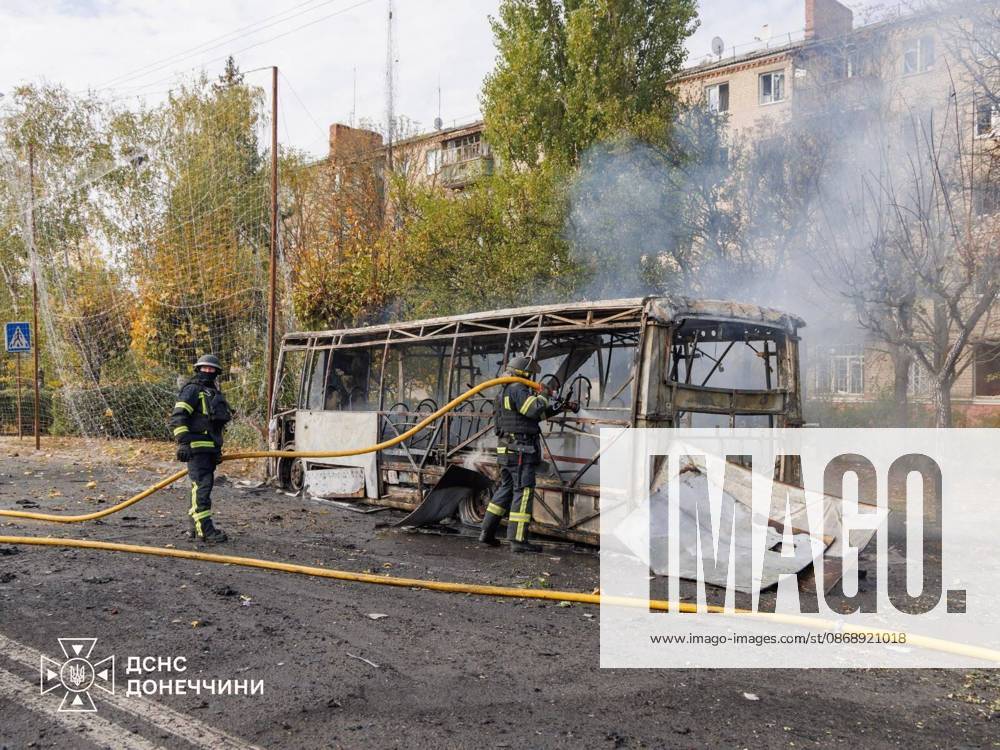 33 killed and 18 injured in Russian strike on passenger buses in Donetsk region s Kramatorsk KRAMATORSK, UKRAINE - OCTOBER 8: (---- - MANDATORY CREDIT - UKRAINIAN STATE EMERGENCY SERVICE HANDOUT - NO MARKETING NO ADVERTISING CAMPAIGNS - DISTRIBUTED AS A SERVICE TO CLIENTS----) Firefighters perform cooling and search operations on the burnt shell of a passenger bus following a Russian missile and aerial bomb strike in Kramatorsk, Donetsk region, Ukraine on October 8, 2026. The strike targeted two civilian buses, killing 30 people in Kramatorsk, while shelling in nearby Bilenke claimed three more lives, bringing the total regional casualties to 33 dead and 18 injured. Emergency personnel recovered a victim from under the
