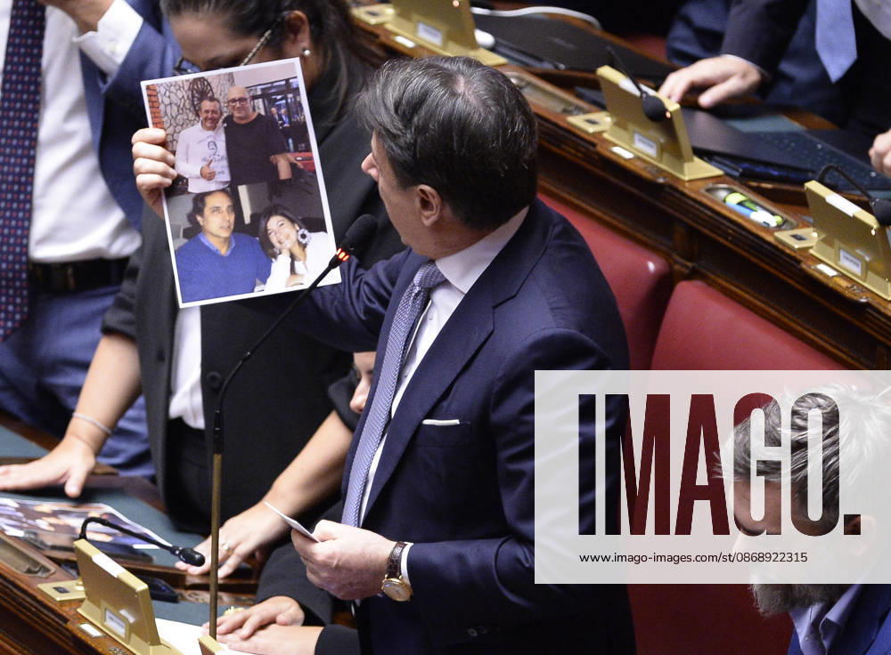 IPA89426082 - Rome, Chamber of Deputies: Electoral Law, explanations of vote, and final vote; in the photo, Giuseppe Conte holds up a picture showing Delmastro with Caroccia and Chiara Colosimo with Ciavardini